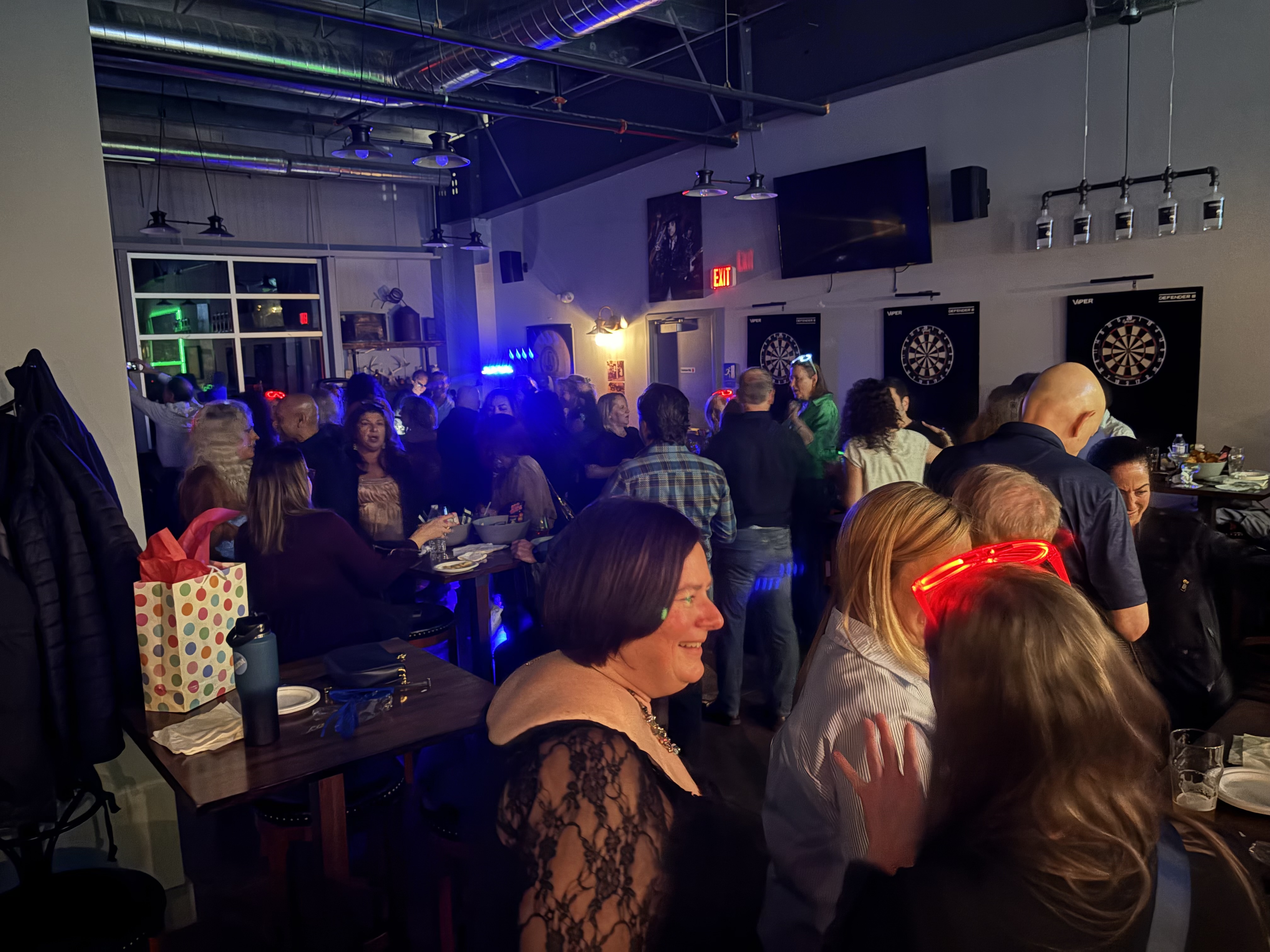 Crowded venue with guests enjoying the party atmosphere