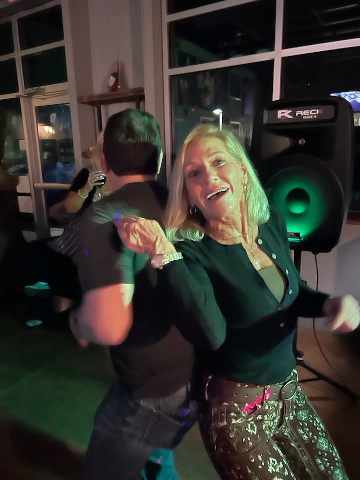 Guest dancing energetically on the dance floor